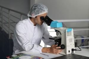 scientist-looking-in-microscope